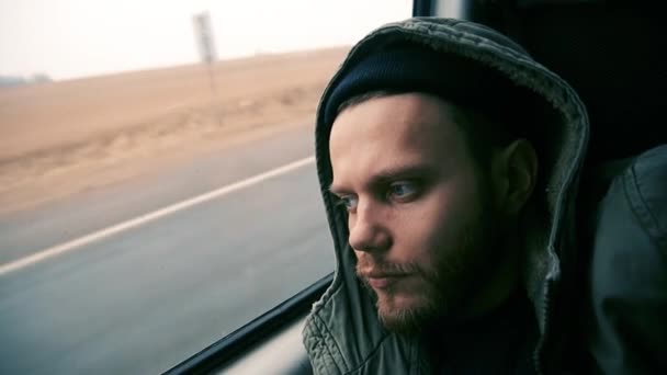 Sad Man Traveler Rides Car Looks Out Window Lonely — Vídeo de Stock