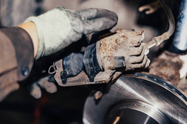 installing car brake pads in the garage