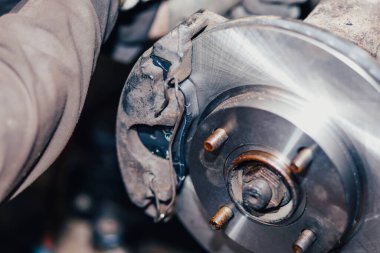 installing car brake pads in the garage