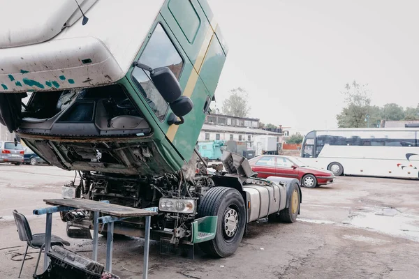 repair of a truck, removed cab, breakdown on the road.