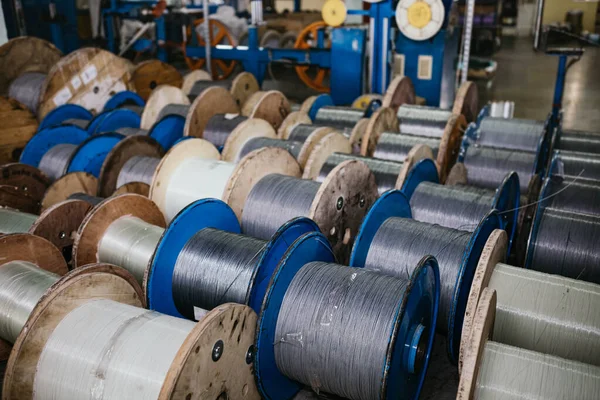 industrial production of optical fiber cable in a factory. Cables for telecommunications, high-voltage lines.