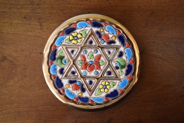 Decorative coaster with golden Jewish Star — Stock Photo, Image