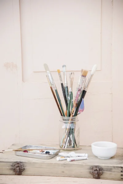 Paint tubes and a bowl. — Stock Photo, Image