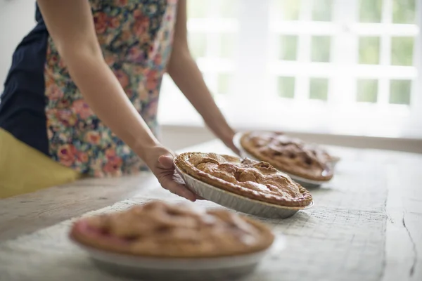 Plates of food being carried to a table. — Stock Photo, Image