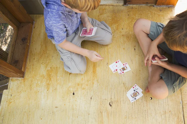 Brothers playing cards — Stock Photo, Image