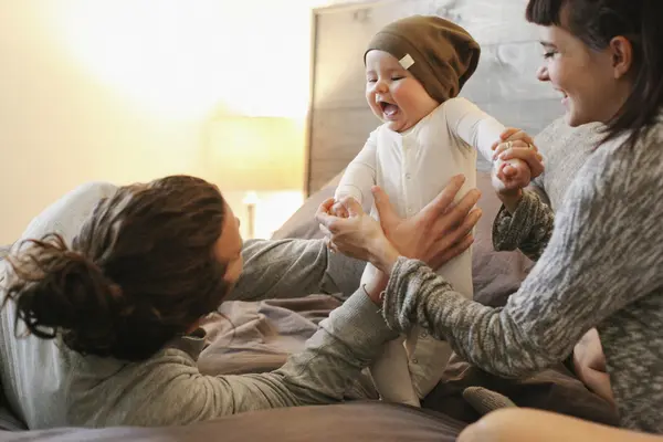 Mother, father and young baby together — Stock Photo, Image