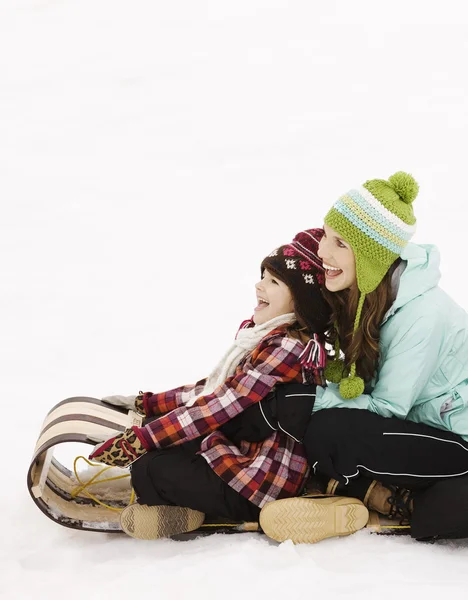 Children sitting on a sledge — Stock Photo, Image