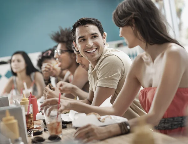 Men and women at a diner. — Stock Photo