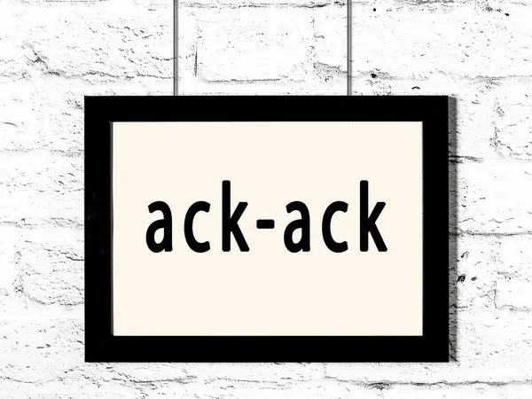 Quadro preto pendurado na parede de tijolo branco com inscrição ack-ack — Fotografia de Stock
