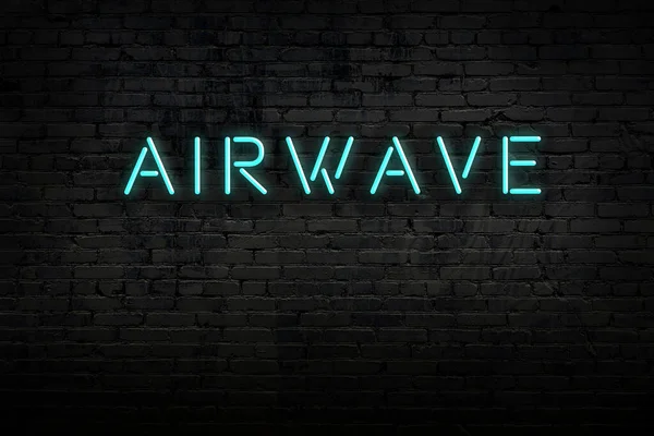 Signo de neón. Airwave palabra contra pared de ladrillo. Vista nocturna — Foto de Stock