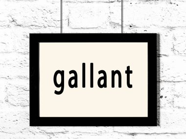 Beyaz tuğladan duvara asılmış siyah çerçeve. Yiğitçe yazılmış.