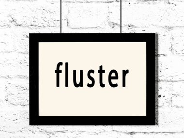 Beyaz tuğla duvarda asılı siyah çerçeve.