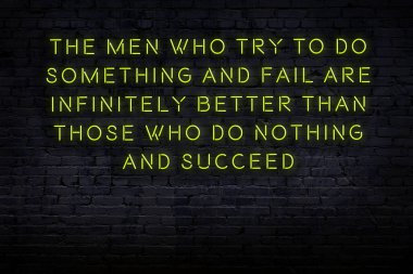 Zekice ve motive edici bir alıntı. Tuğla duvarda neon işareti