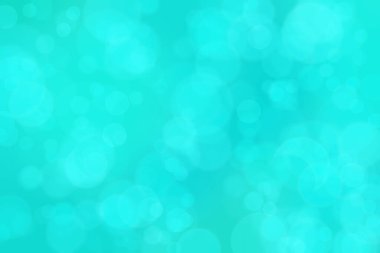 Çember şeklindeki bokeh noktalarıyla mavi ve yeşil soyut odaklanmış arkaplan