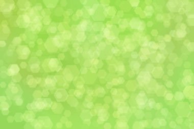 Altıgen şekilli bokeh benekli yeşil soyut odaklanmış arkaplan