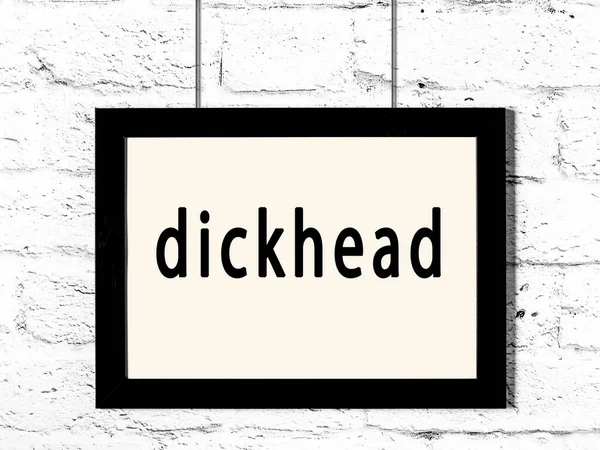 Black Wooden Frame Inscription Dickhead Hanging White Brick Wall — Stockfoto