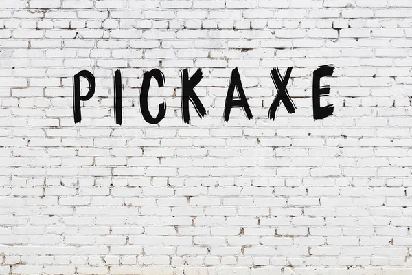 Inscription Pickaxe Written Black Paint White Brick Wall — Stock Photo, Image