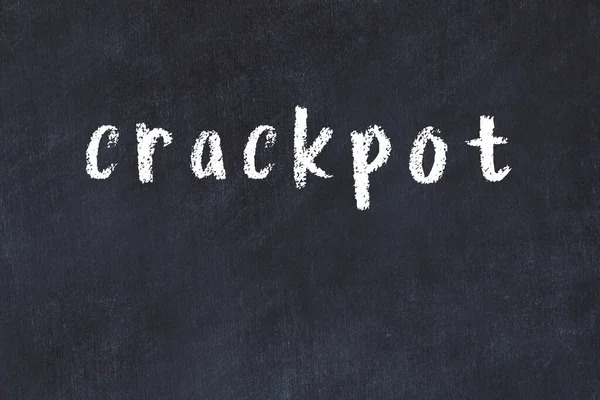 Chalk Handwritten Inscription Crackpot Black Desk — Stock Photo, Image