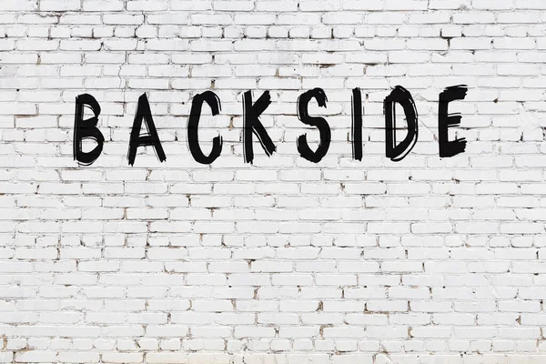 White Brick Wall Inscription Backside Handwritten Black Paint — Stock Photo, Image