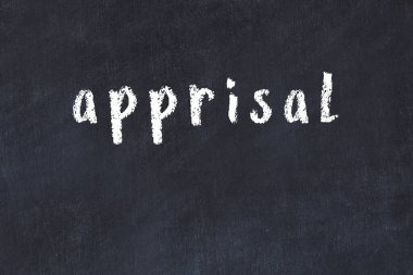 Siyah masaya el yazısı tebeşir yazısı.