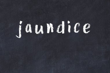 Siyah masada el yazısıyla yazılmış sarılık.