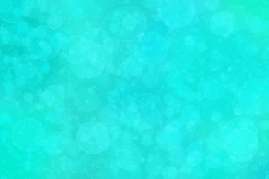 Çember şeklindeki bokeh noktalarıyla mavi ve yeşil soyut odaklanmış arkaplan