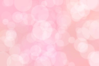 Çember şeklindeki bokeh benekleri ile odaklanmış pembe soyut arkaplan