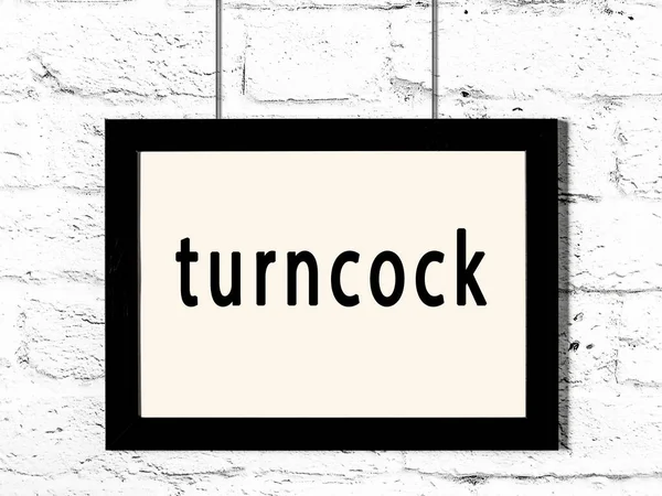 Zwart Houten Frame Met Inscriptie Turncock Opknoping Witte Bakstenen Muur — Stockfoto