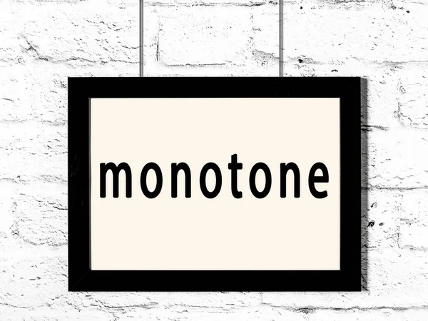 白いレンガの壁に掛け碑文モノトーンと黒の木製フレーム — ストック写真