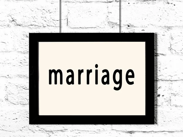 Black Wooden Frame Inscription Marriage Hanging White Brick Wall — Stock Photo, Image