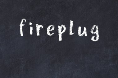 Tebeşir el yazısıyla yazılmış yazması siyah masanın üzerine ateş sapı