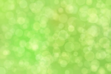 Çember şekilli bokeh benekli yeşil soyut odaklanmış arkaplan