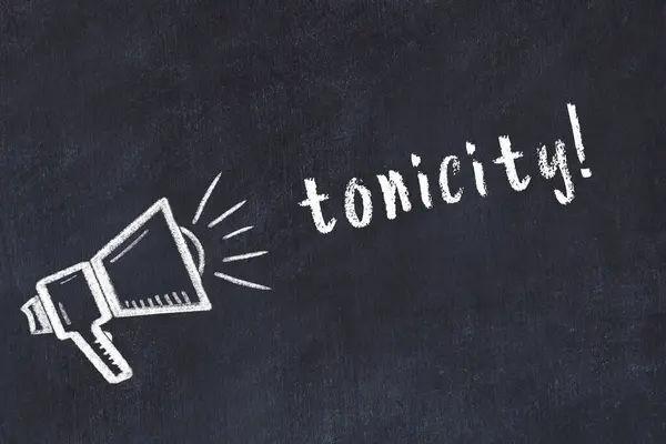 Hoparlör çizimi ve yazı toniği olan siyah karatahta.