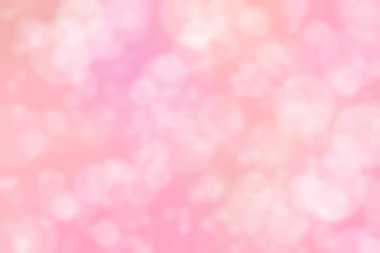 Çember şeklindeki bokeh benekleri ile odaklanmış pembe soyut arkaplan
