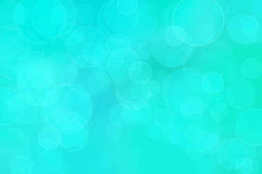 Çember şeklindeki bokeh noktalarıyla mavi ve yeşil soyut odaklanmış arkaplan