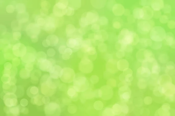 緑の抽象的な背景と円の形のボケスポット — ストック写真