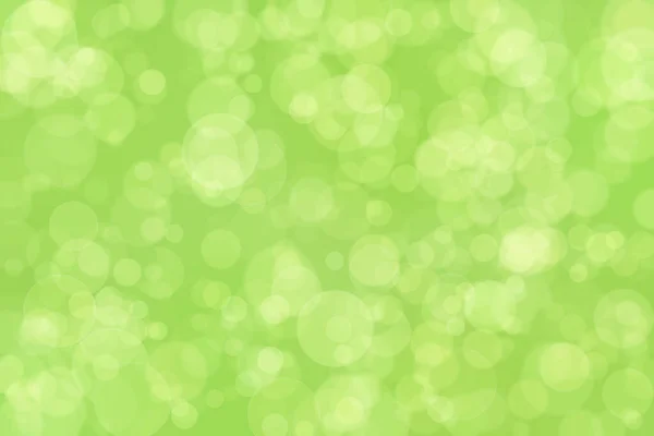 緑の抽象的な背景と円の形のボケスポット — ストック写真
