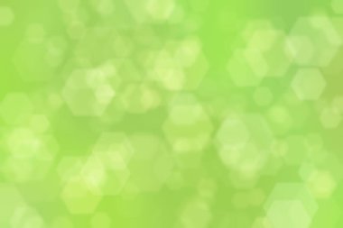 Altıgen şekilli bokeh benekli yeşil soyut odaklanmış arkaplan