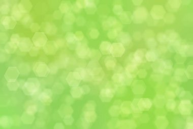 Altıgen şekilli bokeh benekli yeşil soyut odaklanmış arkaplan