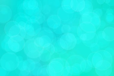 Çember şeklindeki bokeh noktalarıyla mavi ve yeşil soyut odaklanmış arkaplan