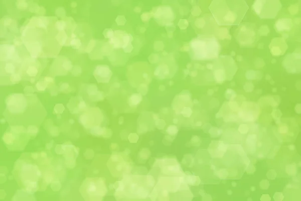 六角形のボケスポットを持つ緑の抽象的背景 — ストック写真