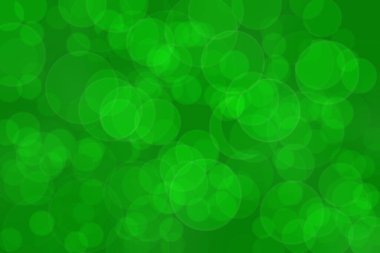 Çember şekilli bokeh benekli yeşil soyut odaklanmış arkaplan
