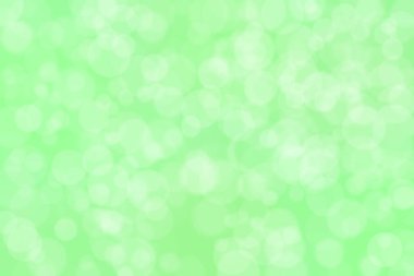 Yeşil arka planda ışık lekeleri. Soyut bokeh.