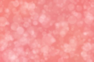 Soyut bokeh arkaplanda kırmızı mercan dairesi şekilli noktalar.