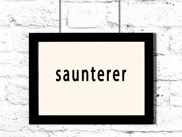 Μαύρο Ξύλινο Πλαίσιο Επιγραφή Saunterer Κρέμεται Λευκό Τοίχο Τούβλο — Φωτογραφία Αρχείου