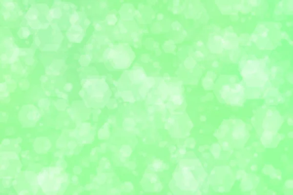六角形のボケスポットを持つ薄緑の抽象的背景 — ストック写真