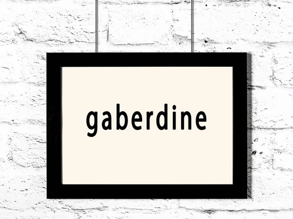 Fekete Keret Felirattal Gaberdine Lóg Fehér Téglafal — Stock Fotó