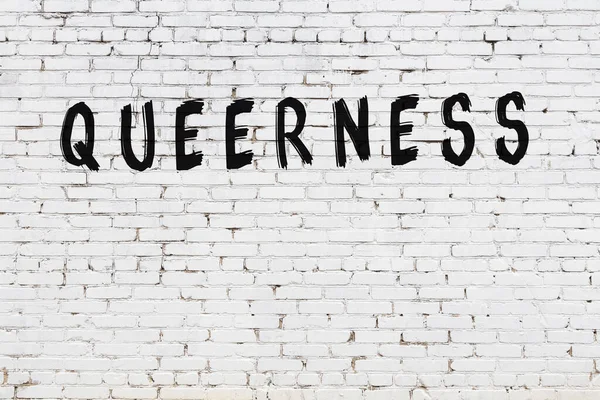 White Brick Wall Inscription Queerness Handwritten Black Paint — Stock Photo, Image