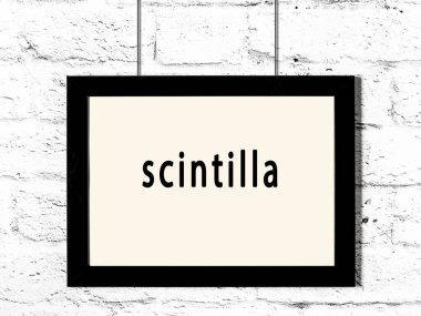 Beyaz tuğla duvarda asılı siyah ahşap çerçeve. 