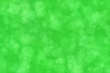 Çember şekilli bokeh benekli yeşil soyut odaklanmış arkaplan